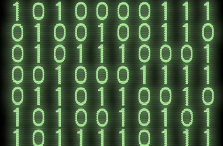 Green binary code on a black screen